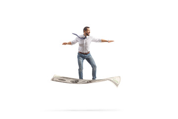 Businessman flying on a banknote