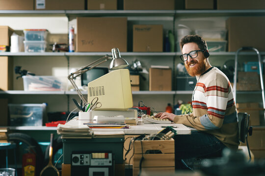 Portrait of a vintage style nerd man in a basement