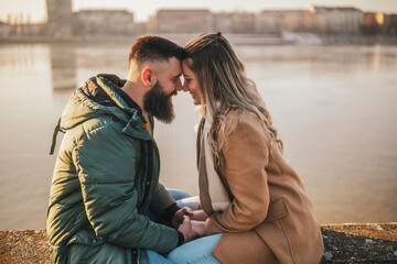 Fototapeta premium Happy couple holding hands while enjoy spending time together outdoor. 