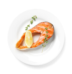 Tasty grilled salmon steak, lemon and thyme isolated on white, top view