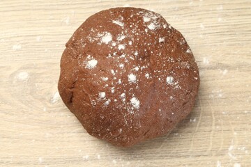 Chocolate dough on wooden table, top view