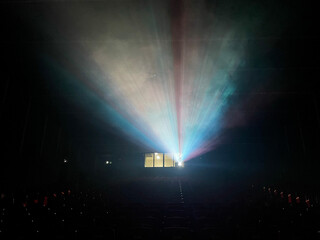 cinema, projector light meets artificial smoke for the show