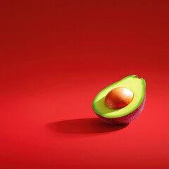 A fresh avocado half showcasing its vibrant green interior against a bold red background.
