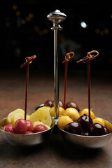 Pickled fruits and berries served as snack