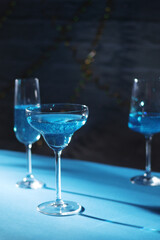 Glasses with blue alcohol cocktail ready for a party