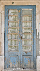 Dilapidated Light Blue Double Door in Nazaré, Portugal