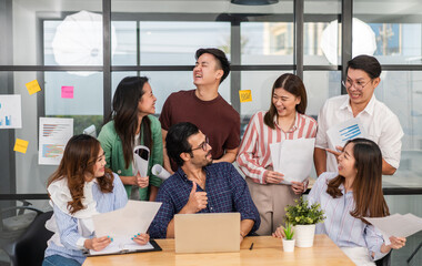 Group of creative asian business meeting and discussing strategy startup project analysis finance process.Success asian business people work plan and brainstorm marketing idea in office.Teamwork