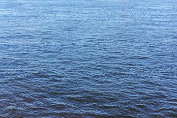 The texture of ripples on the water. Natural background.