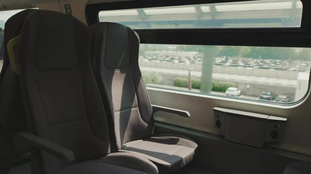 View from inside a train compartment and the landscape outside the window