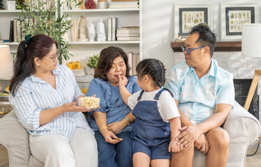 Portrait of happy love family asian father and mother playing with adorable asian kid girl.daughter, care, insurance.Happy family moments good time love with grandparents.Love of big family