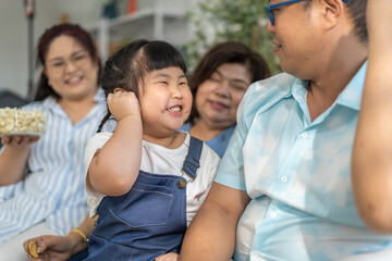 Portrait of happy love family asian father and mother playing with adorable asian kid girl.daughter, care, insurance.Happy family moments good time love with grandparents.Love of big family
