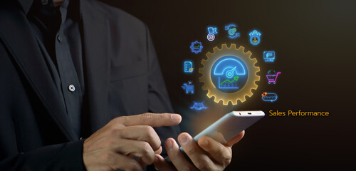 Sales performance management concept. Strategic Decision Making for Operations Management, increase sales and business growth. Businessman hand showing glowing neon line sales performance icons.