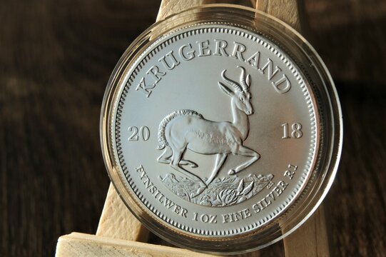 Silver investment coin in capsule. Silver Krugerrand 1 Rand 2018 South Africa. Close up.