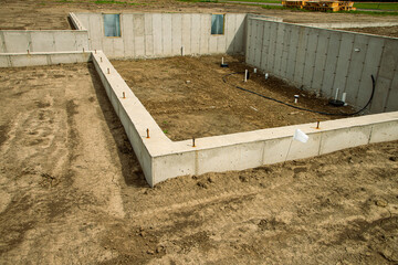 Concrete footings and basement in place, ready for next phase of construction of new home.