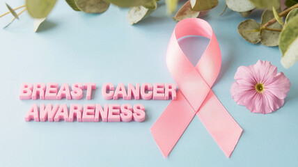 horizontal image of a pink awareness ribbon on an isolated blue background with copy space for text. For Breast Cancer Awareness Month, banner, design, linkedin, clinic, web, medicine, social media