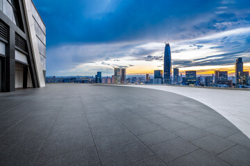 Fototapeta premium Empty brick floor with cityscape in modern city
