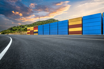 Obraz premium Empty road and stacked containers at port