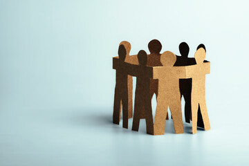 Team work show unity and solidarity concept. Co-workers collaboration. Business cooperation. Social participation. Paper human doll.