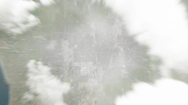 Earth zoom in from space to Compton, California, USA. Followed by zoom out through clouds and atmosphere into space. Satellite view. Travel intro. Images from NASA