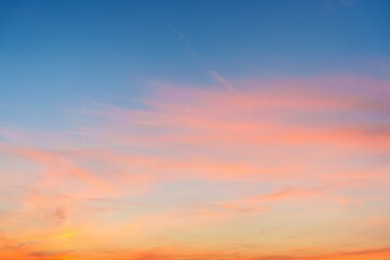 The sunset creates a stunning display in the sky, showcasing vibrant pink, orange, and blue hues. This breathtaking scene is perfect for capturing the beauty of nature at dusk.