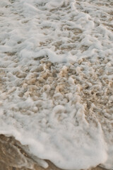 Beach, Sand, Waves. Waves breaking on the beachfront and forming incredible textures