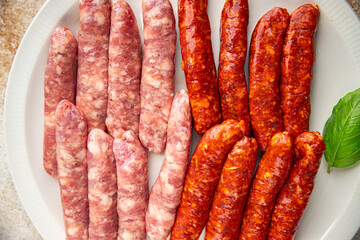 raw sausages beef, pork, chicken, lamb, dish fresh delicious gourmet food background on the table rustic food top view copy space