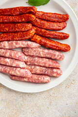 raw sausages beef, pork, chicken, lamb, dish fresh delicious gourmet food background on the table rustic food top view copy space