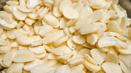 Sliced ​​garlic for background. Indian food.