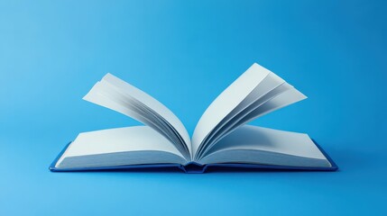 Fototapeta premium An open notebook displays its vibrant blank pages against a bright blue background, inviting thoughts and creativity to flow freely from the pages