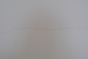 Small cracks on the white wall