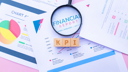 Wooden cube with the word KPI. It is an abbreviation of Key Performance Indicator. Business...