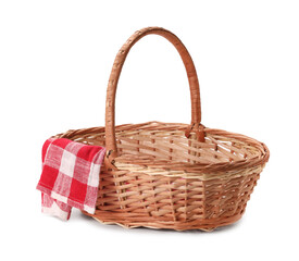 One picnic wicker basket with checkered napkin isolated on white