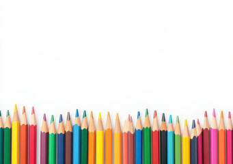Colorful pencils with sharpened tips arranged in a neat row against a white background, representing creativity and art.