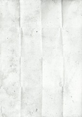 Creased recycled folded paper with dust and scratches. Grunge background texture