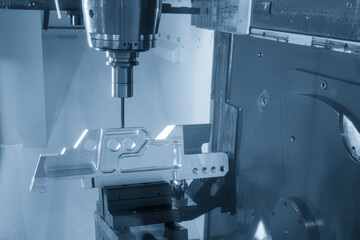 The 5-axis machining center cutting aerospace parts with solid ball end mill tool in the light blue scene.