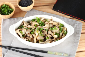 dish of hot mushrooms, in butter and decorated with chives