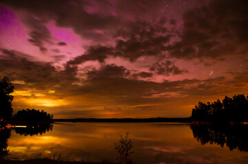 orange purple northern lights in sweden
