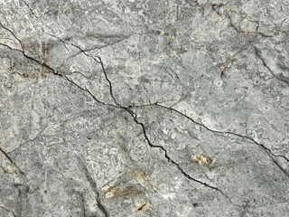 Natural dark grey emperador marble texture with black and golden veinings. Grey and gold natural marble stone, Seamless background texture.