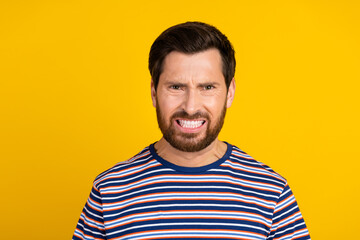 Photo of angry aggressive man with stylish beard dressed striped shirt staring with anger at you...