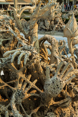 Part of the exterior of White temple Wat Rong Khun, Chiang Rai, Thailand. Hands and arms of sinners in the hell