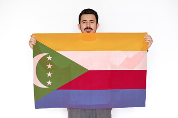 Young man holding Comoros flag, protest or social issues in Comoros, independence day idea, two 