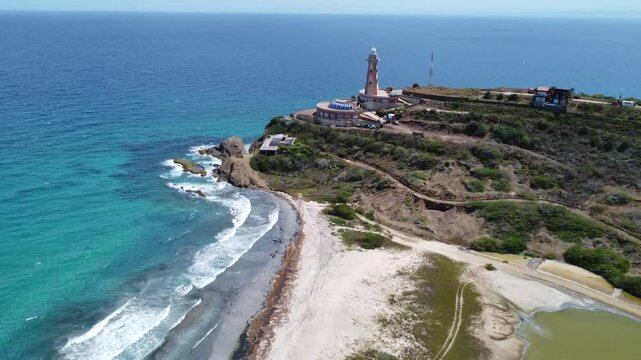 Aerial drone view of Punta Ballena lighthouse and the Caribbean Sea on Margarita Island, Venezuela, on a sunny day.