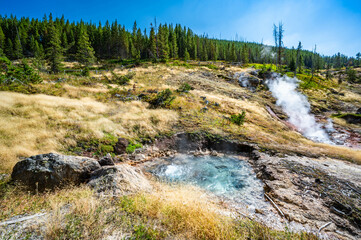 Yellowstone National Park Norris Geyser Basin and Fountain Paint Pots while hiking trails in summer of 2024