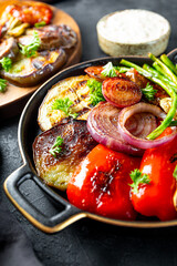 grilled vegetables - eggplant, pepper, onion, tomato and beans close up