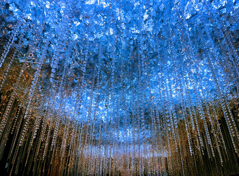 Hanging crystal chandelier made of gemstones, blue topaz and blue sapphire gemstones chandelier with blue lights hanging from ceiling. Luxurious chandelier. 