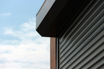 A fragment of the roller doors closing the kiosk.