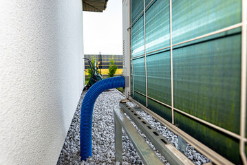 Two efficient outdoor heat pump units placed in front of the house.