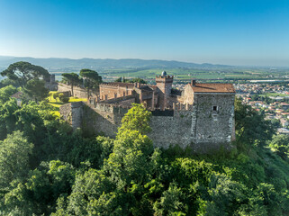Obraz premium Aerial view of hilltop Scaligeri Maltraverso castle near Montebello Vicentino in Italy with restored Gothic palace, battlements, fortified gates