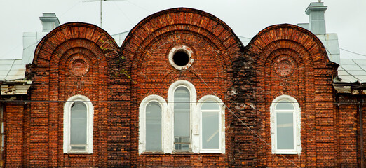 Barred windows of an abandoned mental hospital