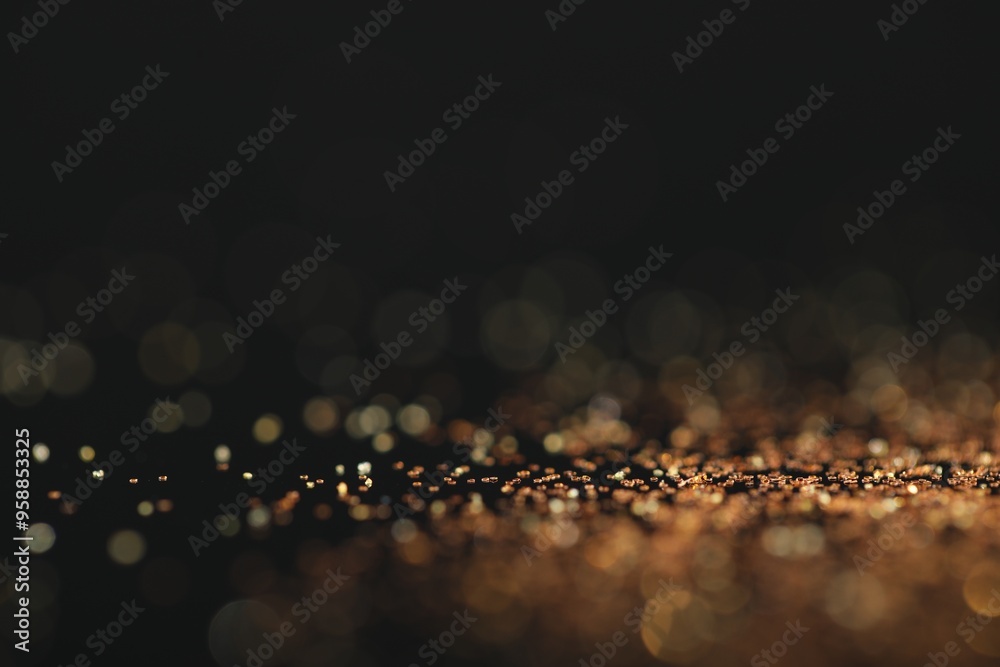 Canvas Prints Beautiful shiny golden glitter on black background, closeup